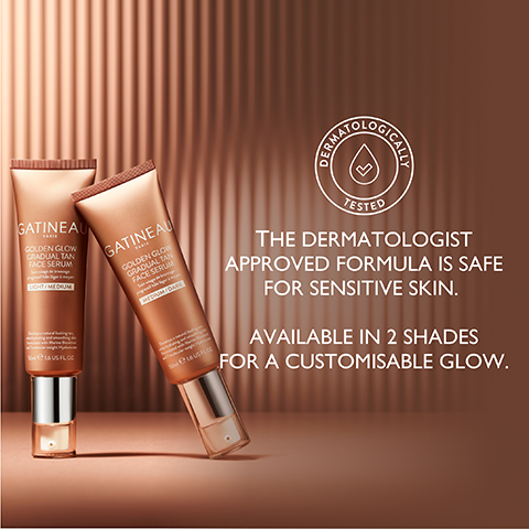 Image 1 - Two tubes of Gatineau Golden Glow Gradual Tan Face Serum are displayed against a rippled brown background, with text stating the dermatologist approved formula is safe for sensitive skin and available in 2 shades for a customizable glow, along with a dermatologically tested symbol.