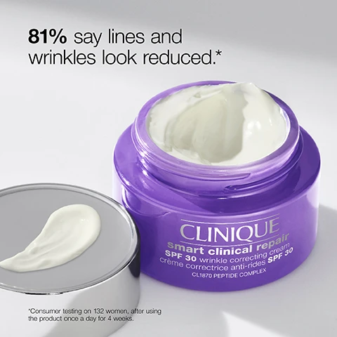 Image 1 - A jar of Clinique Smart Clinical Repair SPF 30 wrinkle correcting cream with its lid off, showing a creamy texture, accompanied by the text 81% say lines and wrinkles look reduced.* *Consumer testing on 132 women, after using the product once a day for 4 weeks.
              Image 2 - A close-up of a smiling woman with a light application of white sunscreen on her cheek, showing a healthy, glowing complexion, accompanied by the text SPF that looks invisible on skin. Get a lightweight, non-greasy finish with no white cast.