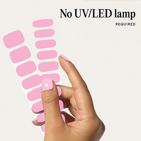 Image 1 - A hand holds pink nail polish strips while wearing similar pink nail polish with the text No UV/LED lamp REQUIRED. Image 2 - Two pink fake nails on a white background with the text 100% real salon-quality gel. Image 3 - A hand with bright pink fingernails touches glossy berry-colored lips Lasts up to 14 days. Image 4 - A hand with pink nail polish and the text 1 minute removal NO DAMAGE. Image 5 - Four illustrated steps showing nail preparation, wrap application, trimming, and removal, with accompanying text instructions: Step by step 01 PREP Use a Wooden Cuticle Stick to gently push back your cuticles and buff the shine off your nail plates with a 240 grit nail file. Cleanse each nail using a Lint Free Wipe soaked in Prep & Wipe to remove any oils this helps the wraps adhere better and last longer. If you dont have these products, washing your hands is a good alternative. If your nails are naturally oily, apply Nail Dehydrator as an extra step after cleansing. 02 STICK & WRAP Choose your favourite design and select the right width wrap for each nail if youre between sizes, go slightly smaller. Peel the wrap from the sheet, touching only the end that wont go on the nail. Apply the wrap as close to the cuticle as possible without touching the skin. Press the wrap firmly from the centre outwards to avoid air bubbles. Use your thumb to press down and seal the edges. 03 TRIM & FILE Trim any excess as close to your nail length as possible using Curved Edged Scissors. After trimming, press the wrap firmly over the free edge of the nail, then file in only one direction, from top to bottom, using a 180 grit nail file. Lightly file underneath the free edge to remove excess and align the edges. Finish by pressing down again to fully seal the wrap in place. Avoid applying any oils or getting your hands wet for at least 2 hours after application to ensure maximum adhesion. Then youre set for up to 14 days! 04 REMOVE Quick, damage-free removal in just 1 minute. Apply Mylee Wrap Remover Oil around the edges of the wrap. Gently lift one side with a Wooden Cuticle Stick and slowly slide it underneath, adding more oil as needed. Once removed, wipe your nails and wash your hands.
