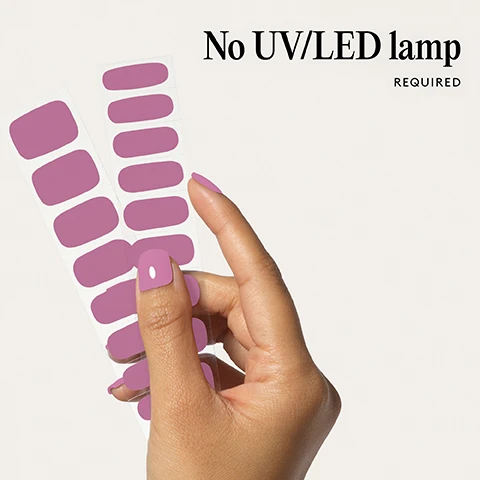 Image 1 - A hand holds two sheets of purple nail polish strips and shows a fingernail painted the same purple color with the text No UV/LED lamp REQUIRED. Image 2 - Two pink nail shapes are shown above the text 100% real salon-quality gel. Image 3 - Close-up of a persons mouth with purple lipstick and hand with purple nail polish touching the lips Lasts up to 14 days Image 4 - A hand shows nails painted with purple polish with the text 1 minute removal NO DAMAGE. Image 5 - An image showing four illustrated steps for applying nail wraps with accompanying text Step by step 01 PREP Use a Wooden Cuticle Stick to gently push back your cuticles and buff the shine off your nail plates with a 240 grit nail file. Cleanse each nail using a Lint Free Wipe soaked in Prep & Wipe to remove any oils - this helps the wraps adhere better and last longer. If you dont have these products, washing your hands is a good alternative. If your nails are naturally oily, apply Nail Dehydrator as an extra step after cleansing. 02 STICK & WRAP Choose your favourite design and select the right width wrap for each nail - if youre between sizes, go slightly smaller. Peel the wrap from the sheet, touching only the end that wont go on the nail. Apply the wrap as close to the cuticle as possible without touching the skin. Press the wrap firmly from the centre outwards to avoid air bubbles. Use your thumb to press down and seal the edges. 03 TRIM & FILE Trim any excess as close to your nail length as possible using Curved Edged Scissors. After trimming, press the wrap firmly over the free edge of the nail, then file in only one direction, from top to bottom, using a 180 grit nail file. Lightly file underneath the free edge to remove excess and align the edges. Finish by pressing down again to fully seal the wrap in place. Avoid applying any oils or getting your hands wet for at least 2 hours after application to ensure maximum adhesion. Then youre set for up to 14 days! 04 REMOVE Quick, damage-free removal in just 1 minute. Apply Mylee Wrap Remover Oil around the edges of the wrap. Gently lift one side with a Wooden Cuticle Stick and slowly slide it underneath, adding more oil as needed. Once removed, wipe your nails and wash your hands. Image 6 - Image shows several red and red and white nail stickers in packaging under a list of features that reads Easiest and gentlest mani in the world Lasts up to 14 days Fast & gentle 1-min removal Fully-cured - No LED Lamp required Comes in 10 sizes Long-lasting shine and chip-resistant Quick and easy application Hema-free, vegan, and cruelty-free Pre-cut and ready to go!.