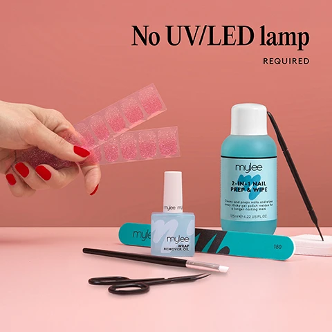 Image 1 - A hand holds pink glitter nail wraps above several Mylee nail products including prep and wipe remover oil nail file cuticle pusher brush and scissors with text overlay reading No UVLED lamp REQUIRED. Image 2 - Image displaying Mylee nail care items like nail wraps, prep and wipe, remover oil, lint free wipes, nail file, brush, scissors, and a tool, alongside the text 1 minute removal NO DAMAGE. Image 3 - An flat lay of mylee nail care products including wipes, scissors, tools, file, red and pink glitter nail wraps, and liquid bottles showing text mylee 100 LINT FREE WIPES Perfect for your prep and finish mylee 180 mylee WRAP REMOVER OIL mylee 2-IN-1 NAIL PREP & WIPE Cleans and preps nails and wipes away sticky gel polish residue for a longer-lasting finish 125ml e 4.22 US FL.OZ. Image 4 - Image shows a Mylee nail kit including red nail stickers bottles of nail prep and wipe and wrap remover oil a nail file brush lint free wipes scissors and a cuticle pusher with text annotations stating Pre-cut pre-designed and ready to go Lasts over 14 days 20x fully cured stickers in 10 sizes for a perfect fit Hema-free vegan and cruelty-free No LED Lamp required Salon-quality shine thats long-lasting & chip-resistant 1-minute removal Quick and easy application mess-free mylee 2-IN-1 NAIL PREP & WIPE 125ml e C 4 22 WRAP REMOVER OIL 100 LINT FREE WIPES Perfect for your prep and finish 240. Image 5 - The image shows a four-step guide for applying and removing nail wraps with illustrations for each step, including the text Step by step 01 PREP Use a Wooden Cuticle Stick to gently push back your cuticles and buff the shine off your nail plates with a 240 grit nail file. Cleanse each nail using a Lint Free Wipe soaked in Prep & Wipe to remove any oils - this helps the wraps adhere better and last longer. If you dont have these products, washing your hands is a good alternative. If your nails are naturally oily, apply Nail Dehydrator as an extra step after cleansing. 02 STICK & WRAP Choose your favourite design and select the right width wrap for each nail - if youre between sizes, go slightly smaller. Peel the wrap from the sheet, touching only the end that wont go on the nail. Apply the wrap as close to the cuticle as possible without touching the skin. Press the wrap firmly from the centre outwards to avoid air bubbles. Use your thumb to press down and seal the edges. 03 TRIM & FILE Trim any excess as close to your nail length as possible using Curved Edged Scissors. After trimming, press the wrap firmly over the free edge of the nail, then file in only one direction, from top to bottom, using a 180 grit nail file. Lightly file underneath the free edge to remove excess and align the edges. Finish by pressing down again to fully seal the wrap in place. Avoid applying any oils or getting your hands wet for at least 2 hours after application to ensure maximum adhesion. Then youre set for up to 14 days! 04 REMOVE Quick, damage-free removal in just 1 minute. Apply Mylee Wrap Remover Oil around the edges of the wrap. Gently lift one side with a Wooden Cuticle Stick and slowly slide it underneath, adding more oil as needed. Once removed, wipe your nails and wash your hands.