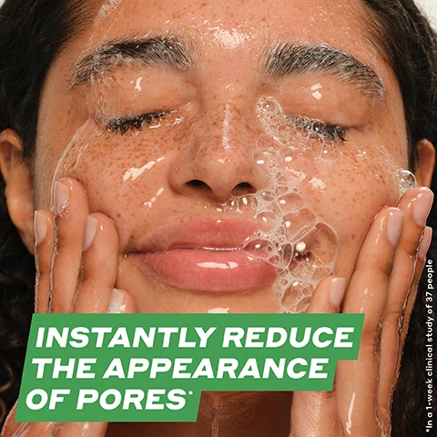 Image 2 - A close-up of a woman with curly hair washing her face, water and bubbles visible on her skin, with text reading INSTANTLY REDUCE THE APPEARANCE OF PORES* in bold white lettering on a green background.
              Image 3 - A green tube labeled Daily D-Clog Pore-Clearing Cleanser against a white background, covered in bubbles, with text stating 92% agree it clears blemishes in just 1 week, instantly reduces the appearance of pores, and instantly reduces oil by 78%, along with a note about a clinical study of 37 people after one use.
              Image 4 - An image showing a creamy skincare product with a curved dollop, accompanied by labeled icons for key ingredients: Salicylic Acid (BHA), Betaine Salicylate, Danish Purple Willow Ferment, Juniper Berry, and Cucumber Extract, with the text CLEAR PORES + CALM SKIN prominently displayed at the top.
              Image 5 - A close-up of light beige, creamy gel with bubbles and a smooth texture, featuring the text PLUSH MILKY GEL WITH A CUSHIONY SOFT LATHER.
              Image 6 - A flat lay of skincare products arranged on a light background, including tubes and jars labeled with the following steps: 01 / CLEANSE DAILY D-CLOG CLEANSER Instantly reduces the appearance of pores* 02 / EXTRACT IMPURITIES COLD PLUNGE PORE MASK Clears congested pores* 03 / TREAT BLEMISHES DETOX DROPS TONER Improves blemishes in just 1 week* 04 / HYDRATE STRENGTH MOISTURIZER 2x hydration instantly*