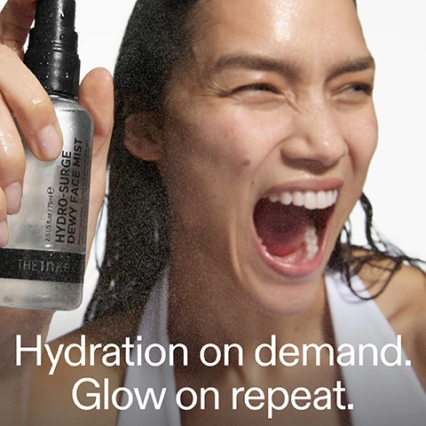 Image 1 - A woman with wet hair joyfully sprays a facial mist from a bottle labeled HYDRO-SURGE DEWY FACE MIST while smiling widely, with the text Hydration on demand. Glow on repeat. visible below.
              Image 2 - Side-by-side comparison of a womans face showing the effects of a product, with Before on the left displaying a matte complexion and After on the right showing a dewy appearance, with visible text reading HYDRO-SURGE DEWY FACE MIST and ON BARE SKIN.
              Image 3 - A close-up of a smiling woman with clear skin showcasing healthy glow, with the visible text stating 12 hour hydration + an instant glow*, HEALTHY SKIN, and additional text below regarding clinical patch-test and consumer trial details.
              Image 4 - A woman smiles while touching her face, showcasing fresh and dewy skin, with text above that reads Ultra-fine cloud-like mist refreshes skin without messing with makeup or SPF.
              Image 5 - A person holding a small spray bottle labeled Hydro-Surge Dewy Face Mist with text that reads Hydrate Clinically proven to deliver 12-hour hydration, Support Improves skin barrier function for 12 hours, Glow Delivers an instant glow - even over makeup.
              Image 6 - Image showing a list of skincare ingredients with their benefits, including 3% Hydroviton Insta for 12H hydration, 3% Aquaxyl to strengthen the skin barrier, and 2% Earth Marine Water to instantly brighten skin, with the title INGREDIENTS.
              Image 7 - A close-up of a skincare mist bottle with a black pump, mist spraying out, and visible text that reads use: am + pm within your skincare routine and on-the-go amount: mist a thin layer across face.
