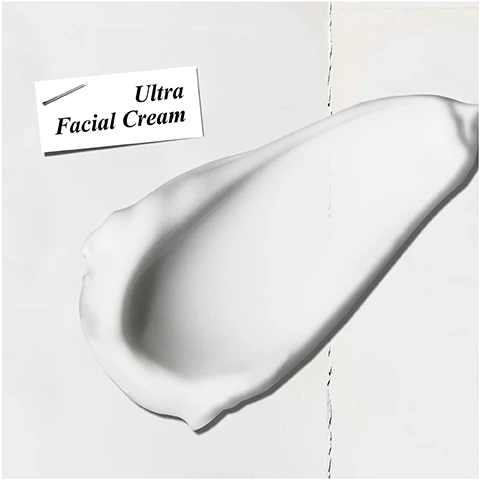 Image 1 - A smooth, white cream is spread on a surface with a label above reading Ultra Facial Cream.
              Image 2 - A person with dark skin is applying a white cream on their cheek, with one hand holding the cream and the other pointing at it; visible text reads HYDRATING Moisturiser.
              Image 3 - The image features a bright blue background with an inset photo of crystalline ice, surrounded by ice fragments, and the text includes Our Formula With: Glacial Glycoprotein Squalane.
              Image 4 - An image of a Kiehls Ultra Facial Cream jar with a refill pouch positioned above it, a message on the left side reads NOW REFILLABLE REUSE, REFILL.
              Image 5 - A flat lay of Kiehls skincare products featuring a box labeled Kiehls containing a hydration refill packet and a jar of Ultra Facial Cream, accompanied by a note that reads Give the gift of sustainable hydration.