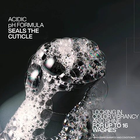 Image 1 - An image of a close-up of a black container with foamy bubbles, featuring text that reads ACIDIC pH FORMULA SEALS THE CUTICLE LOCKING IN COLOR VIBRANCY AND SHINE FOR UP TO 16 WASHES* WHEN USING SHAMPOO AND CONDITIONER.
              Image 2 - A black spray bottle labeled REDKEN 5TH AVENUE NYC with the text acidic color gloss heat protection treatment is displayed against a light pink background, featuring phrases INVISIBLE SHIELD TECHNOLOGY, 13X SMOOTHER HAIR, and 230°C HEAT PROTECTION.
              Image 3 - Image depicts a woman with wavy, medium-length hair divided into two sections labeled BEFORE and AFTER, with the right side showing enhanced color vibrancy and the text BOOST COLOR VIBRANCY FOR UP TO 16 WASHES USING ACIDIC COLOR GLOSS SHAMPOO & CONDITIONER.
              Image 4 - A person with long, wavy red hair is shown from the back, with the left side representing the hairs condition before treatment, which is frizzy and unruly, while the right side shows the after treatment results, which are smooth and wavy; visible text includes BEFORE on the left and AFTER* on the right, along with a note at the bottom that reads *ONE USE OF ACIDIC COLOR GLOSS SYSTEM.
              Image 5 - Image showing a step-by-step guide on using Acidic Color Gloss, with four numbered steps; step 1 features a person shampooing hair, step 2 shows a bottle of Redken Acidic Color Gloss with instructions to apply to towel-dried hair for 5 minutes, step 3 depicts conditioner being dispensed from a bottle, and step 4 shows a person spraying leave-in treatment onto damp hair.
              Image 6 - The image shows four steps of a hair care routine featuring Redken products: a black bottle labeled acidiC color gloss for cleansing, a bottle for glossing, a bottle for conditioning, and a spray bottle for leave-in and protection, with visible step numbers 1 to 4 and descriptions of each function.
              Image 7 - A hand holding a spray bottle is releasing a mist of liquid with the text Leave-In Heat Protectant Spray prominently displayed.
              Image 8 - Image shows a side-by-side comparison of hair before and after treatment, with the left side displaying dull hair and the right side showcasing shiny, styled hair; visible text includes Glass-like shine for up to 3-days, before, after, look created using Redken SEQ (Redken salon only service) and Acidic Color Gloss, and @styledbyclairelouise.
              Image 9 - A close-up image of a black spray bottle labeled Redken Acidic Color Gloss, featuring promotional text about the products effectiveness for hair care, with a five-star rating and customer testimonial on a light pink background.
              Image 10 - A person is washing their hair with shampoo, and visible text in the image states SULFATE-FREE FOR A GENTLE CLEANSE.