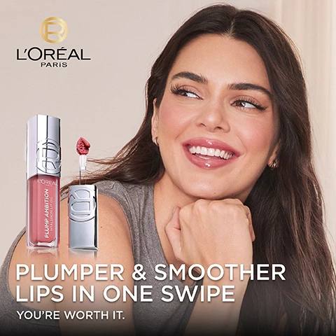 Image 1 - A smiling woman with long dark hair rests her chin on her hand, holding a lip product with the text PLUMPER & SMOOTHER LIPS IN ONE SWIPE and YOURE WORTH IT displayed beneath; the LOréal Paris logo is at the top.
              Image 2 - A close-up of a woman applying lip gloss with a lip applicator while showcasing her lips and jawline, with the text “SMOOTHER LOOKING LIPS” and “WITH VOLUMISING SHINE” displayed prominently.
              Image 3 - The image shows a comparison of lips in two different states, with the top and bottom left labeled BEFORE and the top and bottom right labeled AFTER, indicating enhanced hydration and plumpness in the after images, while the text reads PLUMPER LOOKING & HYDRATED FOR UP TO 24H.
              Image 4 - A close-up image of a pink lip oil tube with a doe-foot applicator, featuring text that reads HYALURON LIP OIL POWERED BY [HYALURONIC ACID] + [TRIPEPTIDES] INSTANTLY PLUMPER LOOKING HYDRATED FOR UP TO 24H SUITABLE FOR SENSITIVE LIPS.
              Image 5 - Close-up of glossy, lightly tinted lips with a lip gloss applicator featuring massaging beads, accompanied by text that reads MAXI CUSHIONY APPLICATOR and with MASSAGING BEADS.
              Image 6 - A pair of hands hold lip products with swatches in various shades displayed on two arms, and the text reads 9 AMBITIOUS SHADES along with shade numbers 101, 601, 641, 650, 380, 390, 510, 485, and 490.