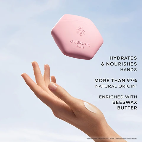 Image 1 - A woman’s hand is shown reaching for a pink hexagonal container labeled Guerlain Paris, with text next to the hand stating hydrates & nourishes hands, more than 97% natural origin, and enriched with beeswax butter.
              Image 2 - A collection of various roses and petals in soft colors, with visible text stating Lychee Note, Blackcurrant Note, Rose.
              Image 3 - An elegant bottle of Guerlains Aqua Allegoria Rosa Rossa perfume stands next to a pink jar labeled Guerlain Paris, with the text ROSA ROSSA SCENTED RITUAL visible in the top left corner.