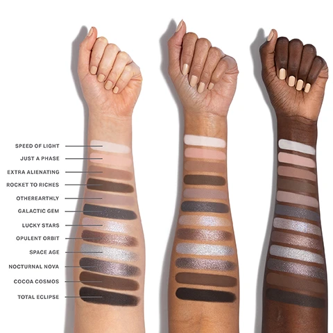 Image 1 - Three arms with swatches of different shades of makeup on their forearms, labeled with names including Speed of Light, Just a Phase, Extra Alienating, Rocket to Riches, Otherearthly, Galactic Gem, Lucky Stars, Opulent Orbit, Space Age, Nocturnal Nova, Cocoa Cosmos, and Total Eclipse.
              Image 2 - A grid of twelve eyeshadow shades arranged in four rows, featuring various colors and textures with numbers 01 to 12 indicating each shade, labeled with names such as Speed of Light, Just a Phase, and Cocoa Cosmos.
              Image 3 - A close-up of an eye showcasing a dramatic makeup look with blended shades of silver and black eyeshadow, complemented by long eyelashes, with a palette of eyeshadow colors labeled 03, 04, 07, 08, and 12 shown below.
              Image 4 - Close-up image of a womans eye with smoky eyeshadow and long eyelashes, featuring a color palette beneath showing shades labeled 01, 04, and 05.
              Image 5 - An image featuring three eye shadow pigments in shades of brown and pink, accompanied by text describing the features of a product: THE POWER OF CHROMAPLUS BLEND, PIGMENT-PACKED PERFORMANCE, ALL-DAY, CREASEPROOF WEAR, and LUXURIOUS BLENDABILITY & BUILDABILITY.
              Image 6 - An image of three open eyeshadow palettes displayed at an angle, showcasing various colored shades inside, with text that reads INFINITE BUT COMPACT CURATIONS, NEXT-GEN FORMATS Choose from 6- or 12-pan palettes—designed for any mood and every moment, ENDLESS EXPRESSION Build versatile looks with timeless and trending shades, and READY WHEN YOU ARE Apply on the go with a built-in mirror.
              Image 7 - An image showing three categories of cosmetic finishes with close-up textures: Seamless Mattes with a smooth pink background and text describing them as smooth and ultrablendable; Luminous Shimmers featuring a sparkling pink surface and text describing them as silky and radiant; High-Shine Metallics with a glittery pink texture and text stating they are creamy and high-impact.