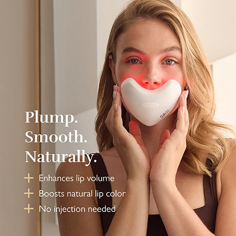 Image 1 - A woman holds a white heart-shaped device emitting red light to her lips with the text Plump. Smooth. Naturally. + Enhances lip volume + Boosts natural lip color + No injection needed Silkn.
              Image 2 - A hand holds a pink heart-shaped light therapy device with lights and text reads Effortless rejuvenation + Stimulates collagen + Enhances elastin + Boost microcirculation.
              Image 3 - Close-up of a mouth with a finger touching the lower lip, overlaid with text reading 5 minute session time and Results in just 2 weeks.
              Image 4 - Two pink LED facial devices on a marble surface, one showing lit bulbs and the other closed, with the text Next level LED Technology 120 LED lights bulbs Wavelengths between 605nm - 1072nm Irradiance between 27.0 - 40.2 mW/cm².
              Image 5 - A woman holds a pink heart-shaped LED light therapy device near her face and shoulder with text stating Volume, firmness & anti-ageing + Stimulates collagen + Boosts elastin + Rejuvenates lips & surrounding skin.
              Image 6 - Close up of two women with healthy glowing skin overlapping faces, with text Even skin tone & soothing glow + Reduces pigmentation & redness + Boosts microcirculation.