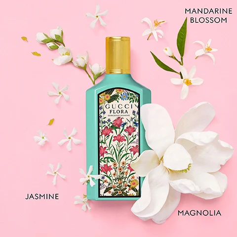 Image 3 - A teal Gucci Flora Gorgeous Jasmine perfume bottle with a floral label and gold cap is surrounded by white jasmine and mandarine blossom flowers, a large white magnolia flower, and scattered petals on a pink background, with text reading GUCCI FLORA GORGEOUS JASMINE, MANDARINE BLOSSOM, JASMINE, and MAGNOLIA. Image 4 - A model lies among flowers holding a yellow Gucci Flora perfume bottle, with the Hollywood sign in the background and text reading GUCCI FLORA. Image 5 - Four colorful Gucci Flora perfume bottles in purple, pink, yellow, and teal are displayed among flowers with text that reads GORGEOUS MAGNOLIA MAGNOLIA ESSENCE DEWBERRIES ACCORD PATCHOULI ESSENCE GUCCI FLORA GORGEOUS MAGNOLIA GORGEOUS GARDENIA WHITE GARDENIA GRANDIFLORUM JASMINE PEAR BLOSSOM GUCCI FLORA GORGEOUS GARDENIA GORGEOUS ORCHID VANILLA ORCHID VANILLA DUO OZONIC ACCORD GUCCI FLORA GORGEOUS ORCHID GORGEOUS JASMINE GRANDIFLORUM JASMINE MAGNOLIA ACCORD MANDARINE ESSENCE GUCCI FLORA GORGEOUS JASMINE.