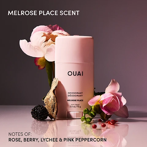 Image 1 - A light pink Ouai deodorant stick sits on a reflective surface surrounded by a white and pink peony, a pink freesia, a blackberry, dried wood, and red berries, with visible text MELROSE PLACE SCENT, OUAI DEODORANT DÉODORANT MELROSE PLACE NET WT. / POIDS NET 2.5 oz / 72 g, NOTES OF: ROSE, BERRY, LYCHEE & PINK PEPPERCORN. Image 2 - A person with long curly hair, wearing a light pink top and sheer shorts, sits on the floor with one arm raised, next to a pink Ouai deodorant stick, with visible text that reads NEW MELROSE PLACE DEODORANT, GOES ON CLEAR, ALUMINUM-FREE, SMELL LIKE ROSES FOR 24 HOURS, and the Ouai stick label shows DEODORANT DÉODORANT MELROSE PLACE. Image 3 - Three pink Ouai deodorant sticks are displayed, one upright in the center and another on its side, with visible text on the upright stick reading OUAI DEODORANT DÉODORANT MELROSE PLACE NET WT. / POIDS NET 2.5 oz / 72 g, and icons below stating ALUMINUM-FREE, BAKING SODA-FREE, CRUELTY-FREE, RECYCLABLE, SUSTAINABLE. Image 4 - A woman with long curly hair in a dance pose wears a light pink top and flowy shorts with ballet shoes against a light background, with the text SWIPE YOUR SCENT and NEW MELROSE PLACE DEODORANT EVERYTHINGS COMING UP ROSES. Image 5 - A person with dark curly hair and closed eyes applies a light pink stick deodorant to their armpit, with their left arm raised behind their head, and the image includes the text GOES ON CLEAR and on the deodorant OUAI DEODORANT DÉODORANT MELROSE PLACE NET WT / POIDS NET 2.5 oz / 72 g. Image 6 - A pink Ouai deodorant stick with its cap removed displays the solid product inside, positioned next to the cap, with surrounding text callouts: Tapioca Starch Helps absorb moisture, Shea Butter Hydrates leaves skin looking soft & smooth, Piroctone Olamine Neutralizes body odor & helps you stay fresh, Coconut Oil Moisturizes & nourishes skin, OUAI, Deodorant, Déodorant, Melrose Place, NET WT. / POIDS NET, 2.5 oz / 72 g.