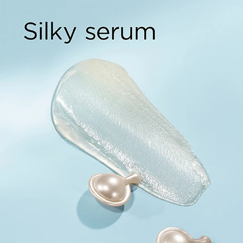 Image 1 - A smear of clear, shimmery serum and two pearlescent capsule pods are on a light blue background, with the text Silky serum. Image 2 - A light blue image divided into four sections visually featuring abstract representations of skincare ingredients: the top left section has three clear spheres, the top right section shows clear liquid droplets, and the bottom right section displays a web of small clear beads connected by strands, with visible text reading Phytoceramides nourish & strengthen, Size-Shifting HA plumps & fills, and Peptides firm & volumize. Image 3 - A smiling woman with blonde hair and blue eyes holds a clear bottle containing pearl-like capsules, labeled Elizabeth Arden NEW YORK HYALURONIC ACID + PEPTIDES Ceramide Capsules Hydra-Plumping Serum Sérum Hydratant Repulpant; the image also includes overlay text that reads 100% show instantly plumper skin* and a disclaimer *Based on a clinical study of 33 panelists immediately after use. Image 4 - A clear bottle filled with pearlescent Elizabeth Arden serum capsules and a silver applicator tool rests on a shelf against a white tiled background, with text Why HA + Peptides? Hyaluronic Acid plumps, Peptides firm, the key to plumper, bouncier skin. displayed prominently, and text on the bottle that reads Elizabeth Arden NEW YORK HYALURONIC ACID + PEPTIDES Ceramide Capsules Hydra-Plumping Serum Sérum Hydratant Repulpant. Image 5 - A before and after comparison of a womans face, showing skin with more visible fine lines on the left and plumper, smoother skin on the right, with the text Before, After, and Skin looks plumper.