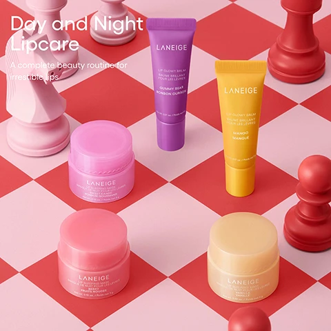 Image 3 - The image shows five Laneige lip products, including two Lip Glowy Balms in purple and yellow tubes and three Lip Sleeping Masks in pink and light orange jars, arranged on a red and light pink checkered surface with four stylized chess pieces, featuring text Day and Night Lipcare, A complete beauty routine for irresistible lips, and product labels that read LANEIGE LIP GLOWY BALM BAUME BRILLANT POUR LES LÈVRES GUMMY BEAR BONBON OURSON Net Wt. 0.17 oz. / Poids net 5 g on the purple tube, LANEIGE LIP GLOWY BALM BAUME BRILLANT POUR LES LÈVRES MANGO MANGUE Net Wt. 0.17 oz. / Poids net 5 g on the yellow tube, LANEIGE LIP SLEEPING MASK MASQUE DE NUIT POUR LES LÈVRES SWEET CANDY BONBON GOURMAND Net wt. 0.10 oz. / Poids net 3 g on the top pink jar, LANEIGE LIP SLEEPING MASK MASQUE DE NUIT POUR LES LÈVRES BERRY FRUITS ROUGES Net wt. 0.10 oz. / Poids net 3 g on the bottom left pink jar, and LANEIGE LIP SLEEPING MASK MASQUE DE NUIT POUR LES LÈVRES VANILLA VANILLE Net wt. 0.10 oz. / Poids net 3 g on the bottom right light orange jar. Image 5 - A festive image with a pink and red geometric background dotted with gold glitter, showcasing a red ribbon gift tag with the gold Laneige logo, beneath which are five mini Laneige lip products: two squeeze tubes (one purple, one yellow) and three small jars (one light yellow, two pink), with visible text that reads HYDRATED, NOURISHED LIPS DAY AND NIGHT LANEIGE MIDNIGHT MINIS [5 PIECES] LES MINIS DE MINUIT [5 SOINS] LIP SLEEPING MASK / MASQUE DE NUIT POUR LES LÈVRES Net Wt. 0.10 oz. / Poids net 3 g [BERRY / FRUITS ROUGES] / [SWEET CANDY / BONBON GOURMAND] / [VANILLA / VANILLE] LIP GLOWY BALM / BAUME BRILLANT POUR LES LÈVRES Net Wt. 0.17 oz. / Poids net 5 g [GUMMY BEAR / BONBON OURSON] / [MANGO / MANGUE] NOT FOR SALE / ÉCHANTILLON GRATUIT! [WATER BANK BLUE HYALURONIC CREAM MOISTURIZER / HYALURONIQUE BLEU Crème Hydratante] 2 mL / 0.06 fl. oz. [CREAM SKIN CERAPEPTIDE™ TONER & MOISTURIZER / TONIQUE & HYDRATANT] 2 mL / 0.06 fl. oz. LANEIGE.