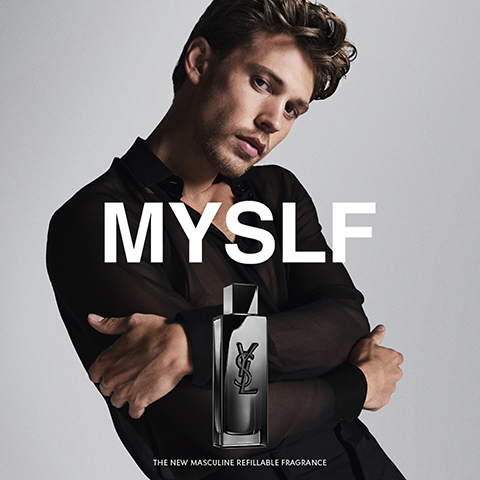 A man poses with a dark perfume bottle in the foreground, displaying the text MYSLF THE NEW MASCULINE REFILLABLE FRAGRANCE.