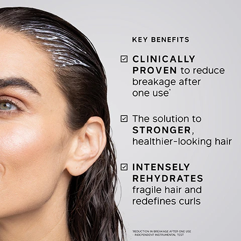 Image 1 - A woman with wet, dark hair and white product on her scalp and hairline is shown on the left, next to a list of product benefits on the right that reads: KEY BENEFITS CLINICALLY PROVEN to reduce breakage after one use^ The solution to STRONGER, healthier-looking hair INTENSELY REHYDRATES fragile hair and redefines curls ^REDUCTION IN BREAKAGE AFTER ONE USE INDEPENDENT INSTRUMENTAL TEST. Image 2 - A white jar of Philip Kingsley Elasticizer Deep-Conditioning Treatment with text PHILIP KINGSLEY ELASTICIZER Adds elasticity and bounce to fine, medium and coarse hair Pour plus delasticité et de tonus sur cheveux fins, moyens et épais DEEP-CONDITIONING TREATMENT TRAITEMENT REVITALISANT EN PROFONDEUR is displayed on a white textured background, beside a list of KEY INGREDIENTS, each with a checked box: HYDROLYZED ELASTIN Helps strands stretch for reduced breakage, CASTOR OIL Helps lock in moisture, OLIVE OIL Boosts health and shine, GLYCERIN Helps retain moisture. Image 3 - A side-by-side comparison of a persons brown hair from the back, showing it frizzy and curly on the left and smooth and straight on the right, with the text BEFORE and AFTER. Image 4 - A woman with her eyes closed and hair wrapped in a white towel, with one hand touching the towel, next to text that reads TRICHOLOGIST TIP After applying Elasticizer, wrap hair in a warm towel. The heat created helps lift the cuticles, allowing the treatment to penetrate more effectively. Image 5 - The image displays a white jar of Philip Kingsley Elasticizer hair treatment with a dollop of product on top, alongside two blurred jars and text stating: 94% reported HAIR NO LONGER FELT LIKE STRAW after first use* 8 in 10 reported hair felt HEALTHIER after FIRST USE* 8 in 10 reported hair felt STRONGER** PHILIP KINGSLEY ELASTICIZER Adds elasticity and bounce to fine, medium and coarse hair Pour plus délasticité et de tonus sur cheveux fins, moyens et épais DEEP-CONDITIONING TREATMENT TRAITEMENT REVITALISANT EN PROFONDEUR *INDEPENDENT USER TRIAL ON VIRGIN HAIR AFTER FIRST USE **INDEPENDENT USER TRIAL ON VIRGIN HAIR AFTER 4 WEEKS USE Image 6 - A hand holds a translucent white jar of Philip Kingsley Elasticizer hair treatment, with a blob of white product on a finger extended over the jar opening, featuring text that reads: I use this product weekly, and WOW. It helps get rid of flyaway frizzy hair. I started using it years ago and cant live without [it]. My hair looks GLOSSY and HEALTHY. CUSTOMER REVIEW PHILIP KINGSLEY ELASTICIZER Adds elasticity and bounce to fine, medium and coarse hair. Pour plus délasticité et de tonus sur cheveux fins, moyens et épais. PREP-CONDITIONING TREATMENT TRAITEMENT REVITALISANT EN PROFONDEUR.