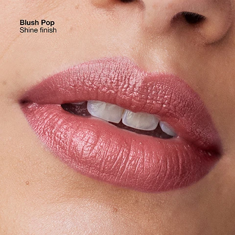 Image 4 - A close-up of a persons mouth with lips painted in a shiny, light pink or blush shade, showing the text Blush Pop Shine finish. Image 5 - A close-up of a persons lips wearing a glossy, light reddish-brown lipstick, with their mouth slightly open showing front teeth, with text that reads Nude Pop Shine finish. Image 6 - A close-up of a persons lips wearing shiny, deep red lipstick with text that reads Cherry Pop Shine finish. Image 7 - A close-up of a persons mouth wearing a shiny berry pink lipstick shade with their teeth slightly visible, with text that reads Love Pop Shine finish.