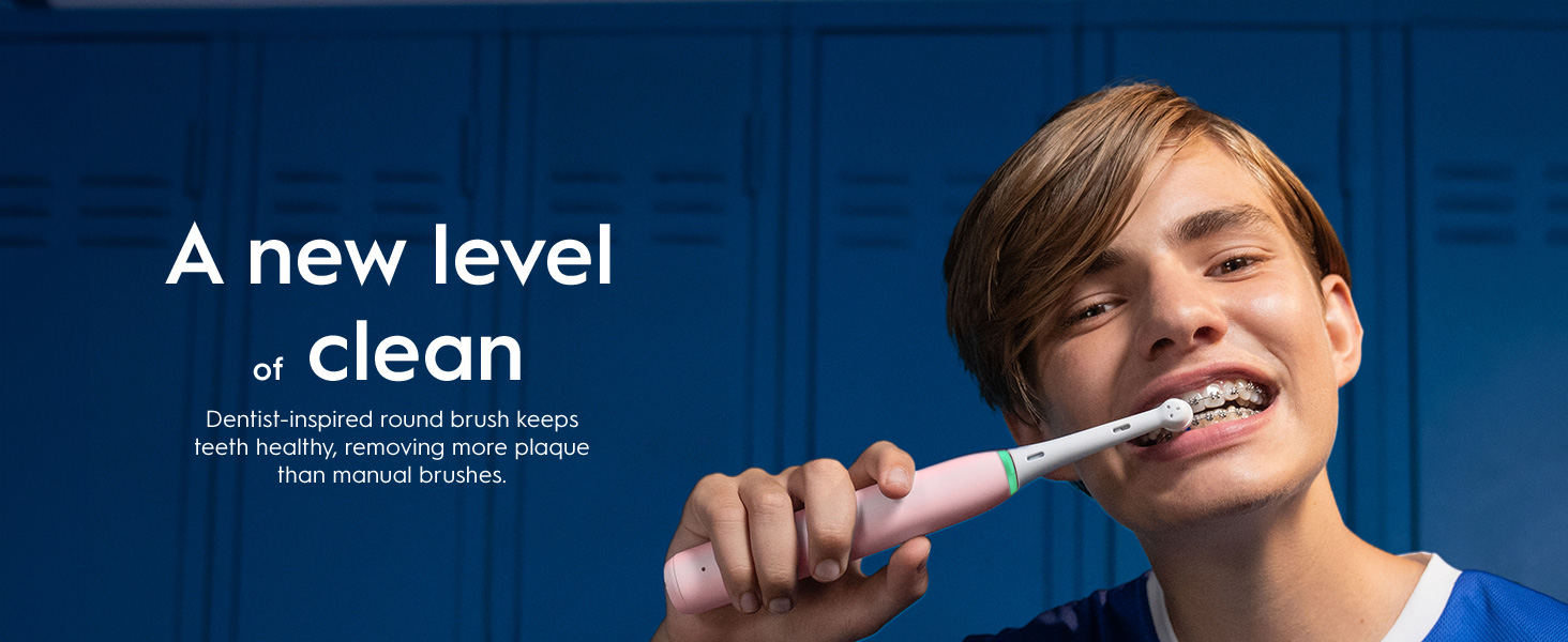 Person with an electric toothbrush. 