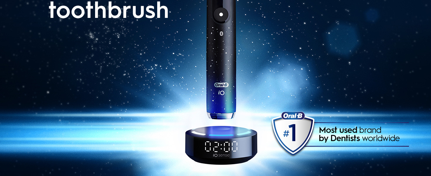 Image shows an Oral-B iO electric toothbrush on a charging base against a starry background with the text toothbrush Oral-B iO 02:00 iO Sense Oral-B #1 Most used brand by Dentists worldwide.