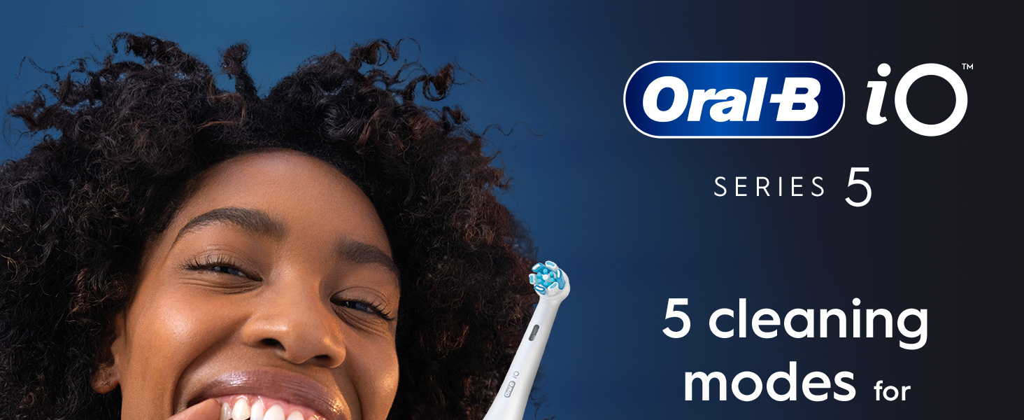 A smiling woman holds an Oral-B iO Series 5 electric toothbrush next to text that reads Oral-B iO SERIES 5 5 cleaning modes for.