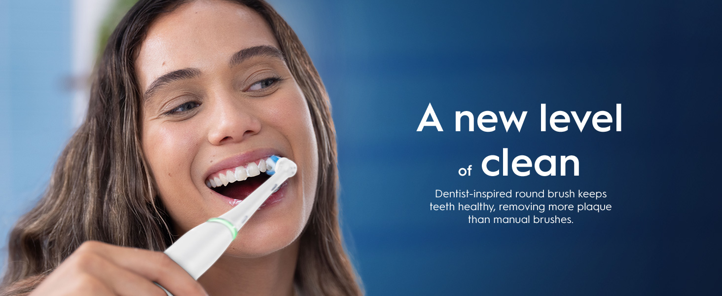 A woman brushes her teeth with an electric toothbrush on a blue background with the text A new level of clean Dentist-inspired round brush keeps teeth healthy, removing more plaque than manual brushes.