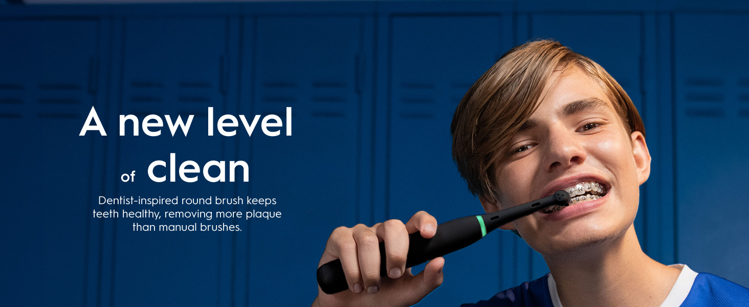 Person with an electric toothbrush. 
