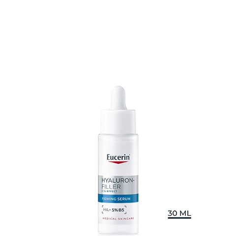 Image 3 - A woman applies a drop of serum to her cheek with a dropper, alongside the text Eucerin, Skin Benefits, Firms intensively, Plumps wrinkles, Repairs skin barrier. Image 4 - A smiling woman touches her cheek, with text reading Eucerin Consumer Validated 100% Confirm* firms the skin and a disclaimer below stating *Product-in-use study was conducted with 160 women. After 4 weeks of regular use. Image 5 - A woman with glowing skin smiles as a dropper applies a drop of serum to her cheek, with text reading Eucerin Highly concentrated formula for younger-looking skin. Image 6 - A close-up of a womans face shows a dropper dispensing white liquid onto her cheek, alongside text that reads Eucerin, Formula & Texture, For all skin types, Ultra-light & fast absorbing, Fragrance-free. Image 7 - A hand holds a white Eucerin Hyaluron-Filler Firming Serum bottle with a dropper, displaying text Eucerin, HYALURON-FILLER + 3X EFFECT, FIRMING SERUM, HA+5% B5, MEDICAL SKINCARE, alongside instructions Apply 1 - 2 drops to face & neck on cleansed skin morning & evening. Image 8 - A graphic displays clear blue water bubbles at the top with the Eucerin logo, and white space below containing text that reads With highly concentrated Provitamin B5, Strengthens the skin barrier, Enhances skin regeneration process, Improves skins resistance to external aggressors. Image 9 - A white graphic with the Eucerin logo at the top, divided into three columns, each showing a visual representation of an ingredient and its benefits: Hyaluronic Acid, depicted by blue liquid with bubbles, states Provides intense hydration and helps smooth fine lines and wrinkles; Provitamin B5, depicted by two large blue spheres, states Strengthen skin barrier by enhancing skin regeneration process; and Glycerin, depicted by clear liquid with small bubbles, states Supports intense hydration and increases moisture significantly. Image 10 - The image displays three numbered Eucerin skincare products on a white background, featuring the Eucerin logo; visible text includes Eucerin, 1, SENSITIVE SKIN, DermatoCLEAN [HYALURON], Cleansing Gel, Clinically Eucerin Tested, DERMATOLOGICAL SKINCARE, DermatoCLEAN [HYALURON] Cleansing Gel, 2, HYALURON-FILLER, + 3x EFFECT, FIRMING SERUM, HA + 5% B5, DERMATOLOGICAL SKINCARE, Hyaluron-Filler + 3x Effect Firming Serum, 3, HYALURON-FILLER, + 3x EFFECT, DAY CARE SPF 30, and Hyaluron-Filler + 3x Effect Day Care SPF 30. Image 2 - A white Eucerin serum bottle with a dropper top, featuring grey and blue label bands, displaying the text Eucerin, HYALURON-FILLER + 3x EFFECT, FIRMING SERUM, HA + 5% B5, MEDICAL SKINCARE, and 30 ML.