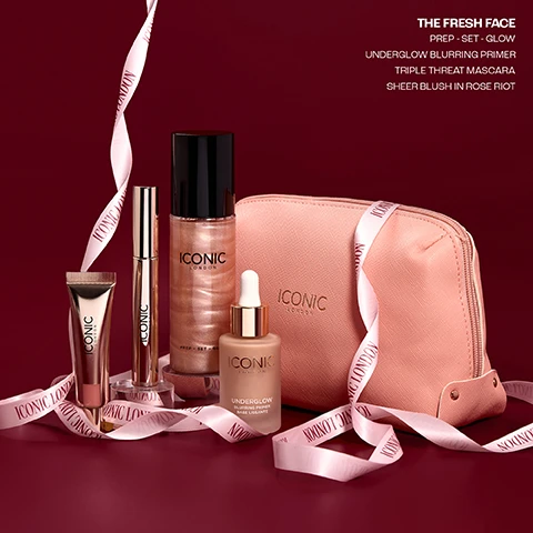 Image 2 - A collection of Iconic London makeup products including a rose gold tube, a mascara wand, a shimmering setting spray, a foundation dropper bottle, and a pink zippered makeup bag, all arranged on a dark red background with a pink ribbon, displaying the text THE FRESH FACE, PREP - SET - GLOW, UNDERGLOW BLURRING PRIMER, TRIPLE THREAT MASCARA, SHEER BLUSH IN ROSE RIOT, as well as ICONIC LONDON on the products and ribbon, and BASE LISSANTE on the foundation bottle. Image 3 - A woman with long dark hair and striking eye makeup holds a gold mascara tube labeled ICONIC LONDON, looking at the camera, with additional text that reads THE FRESH FACE and TRIPLE THREAT MASCARA in the bottom right corner. Image 4 - A group of four Iconic London beauty products is showcased against a light background, including a frosted dropper bottle of primer, a black mascara wand and its gold tube, a small gold squeeze tube, and a tall shimmering rose gold spray bottle of setting mist. The visible text reads The FRESH FACE, TRIPLE THREAT MASCARA, OUR BEST SELLING TRENDING MASCARA, ICONIC LONDON UNDERGLOW BLURRING PRIMER BASE LISSANTE, ICONIC LONDON, ICONIC LONDON, ICONIC LONDON PREP - SET - GLOW, PREP - SET - GLOW, OUR BEST SELLING VIRAL PREP AND SETTING MIST. Image 5 - Four product review cards are displayed on a dark red draped background, showing customer testimonials for beauty products. The first card has a 4-star rating and reads Triple Threat Mascara, My favourite mascara, no clumping and makes my lashes look long, easy to remove. Like it so much brought as gifts ! Claire C. The second card has a 5-star rating and reads Underglow Blurring Primer, So smooth to put on my face, its like silk. It really gives radiance to my skin and a perfect base. I love it so have ordered more! Annie. The third card has a 5-star rating and reads Sheer Blush, I have bought this in several shades and love it. It gives a beautiful sheer flush of colour that looks like you but better. Samantha. The fourth card has a 4-star rating and reads Prep - Set - Glow, I have been buying this product for 5 years now. Not only does it smell lovely but it works so well and really makes my make up look good afterwards. Would definitely recommend it!- Sam. Image 6 - The image shows four panels of cosmetic swatches with product names and benefits: the top left features a shimmering beige liquid for Underglow Blurring Primer with Soft Focus, Blurring Powders, Vitamin C, and Natural Looking Glow; the top right displays a sparkly peachy-pink liquid for Prep-Set-Glow with Cucumber Extract, Chamomile, and Mica; the bottom left shows a coral pink cream texture for Sheer Blush Shade Riot Rose; and the bottom right presents black strokes of Triple Threat Mascara that Volumises, Lengths, and Lifts.