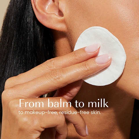 Image 1 - A person uses a white cotton pad to wipe their cheek, with text reading From balm to milk to makeup-free, residue-free skin. Image 2 - A hand holds a dark teal cylindrical container labeled izil THE ARGAN MAKEUP REMOVER & CLEANSING BALM MELT MAKEUP, DEEPLY CLEANSE & NOURISH Argan Oil . Mango Butter . Tea Tree Oil BAUME DÉMAQUILLANT & NETTOYANT À LARGAN بلسم منظف للوجه ومزيل للمكياج بزيت الأركان, with the text Deeply cleanses, Melts makeup, Nourishes listed vertically on the left. Image 3 - A vibrant yellow, glossy substance with flowing textures is shown, featuring white text that lists: 99.98% NATURAL, BALM-TO-MILK FORMULA, CRUELTY-FREE, FREE FROM GMOS, ALCOHOL, ARTIFICIAL COLOURS & FRAGRANCE, SULPHATES. Image 4 - A side-by-side image shows the old and new packaging for Izil Argan Makeup Remover & Cleansing Balm, with the old product on the left in a beige jar with a black lid and green label, and the new product on the right in a solid dark teal jar, displaying the text New Look Same formula you love, with the old label reading izil NOURISH THE ARGAN MELT MAKEUP REMOVER & CLEANSING BALM MADE WITH ARGAN OIL, MANGO BUTTER, SUNFLOWER OIL, CAMELLIA, & MORE ALL SKIN TYPES, and the new label reading izil THE ARGAN MAKEUP REMOVER & CLEANSING BALM MELT MAKEUP, DEEPLY CLEANSE & NOURISH ARGAN OIL, MANGO BUTTER.