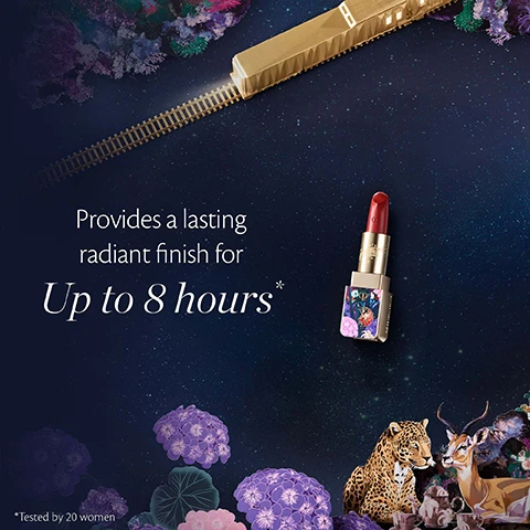 Image 5 - A red lipstick with a decorative gold case is surrounded by a golden train on tracks, a leopard, a deer, and purple flowers against a starry dark blue background, with text that reads Provides a lasting radiant finish for Up to 8 hours * *Tested by 20 women. Image 7 - An artistic image set against a sparkling dark blue night sky, showcasing luxury cosmetic products including a purple serum bottle, red lipstick, face powder compact, purple cream jar, and eyeshadow palette, arranged among stylized purple, pink, and white flowers, a hummingbird, deer, leopard, fawn, ladybug, peacock feathers, and a golden toy train, with visible text Clé de Peau Beauté DREAMS EXPRESS COLLECTION, and on products clé de peau BEAUTÉ LE SÉRUM THE SERUM and clé de peau BEAUTÉ LA CRÈME.