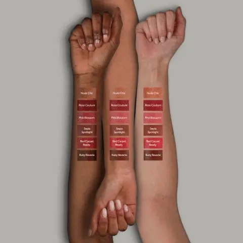 Image 1 - Three arms with different skin tones display six lipstick swatches each, showing the shades Nude Chic, Rose Couture, Pink Blossom, Sepia Spotlight, Red Carpet Ready, and Ruby Reverie. Image 2 - Four open lipstick tubes in shades of red, dark pink, brown, and reddish-brown are arranged diagonally on a light background with text that reads MOISTURE MUSE LIPSTICK, Buildable, sheer perfection for hydrated, luminous lips, Glides effortlessly onto lips for a buttery-soft lasting finish, and A creamy, sheer base that melts into lips, moisturising and accentuating your natural lip colour.