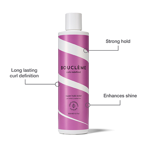 A pink bottle with white diagonal stripes, labeled Bouclème Super Hold Styler, curls redefined, a plant powered curlcare gel coiffant à maintien fort in 300ml e 10.1fl.oz, with callouts indicating strong hold, long lasting curl definition, and enhances shine.