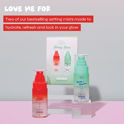 Image 2 - The image shows two setting mist spray bottles, one red-orange and one light green, standing on white platforms with a white product box featuring both bottles behind them, all against a grey and pink background; visible text includes LOVE ME FOR Two of our bestselling setting mists made to hydrate, refresh and lock in your glow, on the box THE BEAUTY CROP Dewy Duo Setting Mist Duo Duo de Brumes Fixatrices, on the red-orange bottle THE BEAUTY CROP Oui Cherie Hydrating Setting Mist Brume fixatrice hydratante enriched with Cherry Extract Hyaluronic Acid & Aloe Vera Avec extrait de cerise, dacide hyaluronique et daloe vera, and on the light green bottle THE BEAUTY CROP Dewy + Bounce Set & Seal Setting Mist Brume fixatrice de maquillage enriched with Snow Mushroom Niacinamide & Hyaluronic Acid Avec champignon des neiges, niacinamide et acide hyaluronique, with both bottles stating SUITABLE FOR ALL SKIN TYPES 75ml e 2.5fl.oz.