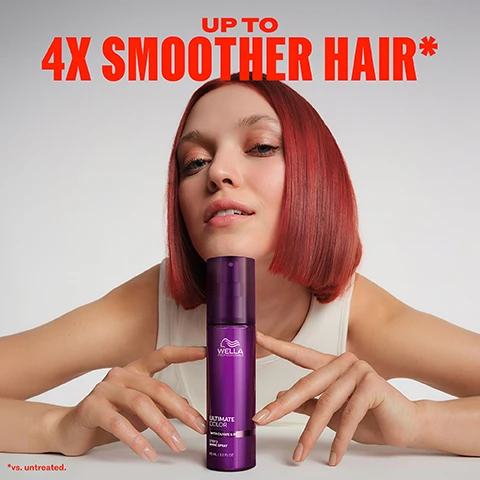Image 1 - A woman with vibrant red, short bobbed hair and a white tank top is shown looking directly forward, her hands gently holding a tall purple Wella Ultimate Color Shine Spray bottle; the image also contains text reading UP TO 4X SMOOTHER HAIR*, WITH DUVET & MILLE, 95 ML / 3.2 FL OZ, and *vs. untreated. Image 2 - A split image shows the back of a person with short red hair, demonstrating a before-and-after comparison where the left side appears dull and slightly frizzy and the right side looks vibrant and smooth, with text that reads BEFORE with non-conditioning shampoo and AFTER with Ultimate Color regimen. Image 3 - A dark purple background with glossy, swirling, abstract purple shapes and bubbles, featuring text that reads OLIVATE Is a conditioning ingredient for smooth hair B5 Helps to replenish & retain moisture from scalp to ends. Image 4 - A hand holds a purple Wella Professionals Ultimate Color spray bottle, releasing a fine mist, with red text that reads MIST TO ADD SHINE AND SMOOTHNESS. Image 5 - A purple Wella Professionals Ultimate Color with Olivate & B5 Step 3 Shine Spray bottle, 95 ML l 3.2 FL OZ, is shown against a red background, with highlighted features Colour Safe, Lasting Smoothness, Shine, and Free of Animal Derived Ingredients. Image 6 - The image shows the back of a person with short, reddish-brown hair being combed with a wide-tooth comb, next to a list of instructions: 1 Style hair as desired. 2 Hold spray a forearms distance away from hair. 3 Spray on dry lengths and ends. Image 7 - Three light pink flowers with orange centers are set against a dark purple, leafy background, with the text FRAGRANCE Unique, fruity & florential fragrance with top notes of orange zest, apple & leafy green. Image 8 - Four purple Wella Professionals hair care products in various bottles and tubes are arranged side-by-side, from left to right, on a gradient grey background, with text reading COLOUR VIBRANCY FOR UP TO 10 WEEKS* UP TO 4X MORE RESISTANCE TO BREAKAGE, STEP 1 Cleanse, Wella Professionals Ultimate Color with Glycine & B5 Step 1 Sulfate-Free Shampoo 250 ml / 8.4 FL OZ e, STEP 2 Condition, Wella Professionals Ultimate Color with Glycine & B5 Step 2 Conditioner 200 ml / 6.7 FL OZ e, STEP 3 INTENSE Leave-In Mask, Wella Professionals Ultimate Color with Glycine & B5 Step 3 Intense Miracle Leave-In Mask 95 ml / 3.2 FL OZ, STEP 4 Finish, Wella Professionals Ultimate Color with Glycine & B5 Step 4 Shine Spray 95 ml / 3.2 FL OZ, and *With regular use of ULTIMATE COLOR regimen from salon to home.