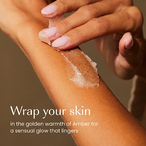 Image 1 - A persons hand applies a shimmering exfoliating scrub onto their forearm, with the text: Wrap your skin in the golden warmth of Amber for a sensual glow that lingers. Image 2 - A hand holds an izil Arnica Reset Body Oil bottle, which is light beige fading to orange, with a persons chin and shoulder visible on the right, and text on the left lists Moisturises, Revitalises, Nourishes, Smooths, while the bottle itself displays izil ARNICA RESET BODY OIL REVITALISE & RELAX HUILE CORPORELLE RELAXANTE A LARNICA زيت الجسم المهدئ بالأرنيكا. Image 3 - Five izil Amber cosmetic products are displayed on stone platforms with ginger and amber stones: izil AMBER CLEANSING SHOWERGEL CLEANSE & HYDRATE for Cleanse, izil AMBER MOISTURISING BODY SCRUB PURIFY & SMOOTH for Exfoliate, izil AMBER MOISTURISING BODY LOTION MOISTURISE & SMOOTH for Moisturise, izil AMBER BODY & HAIR DRY OIL NURTURE & GLOW for Nourish, and izil AMBER HAIR & BODY PERFUME MIST HYDRATE & REFRESH for Refresh.