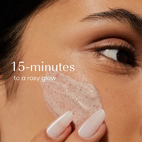 Image 1 - A close-up of a persons face shows a hand with light nails applying a pinkish grainy scrub to the cheek with text that reads 15-minutes to a rosy glow. Image 2 - A persons hands hold a black jar of reddish-pink face mask, with a finger scooping some out, next to text that reads: Strengthens skin barrier, Boosts skin elasticity, Evens skin tone, Glows instantly, izil, AKER FASSI INSTANT GLOW FACE MASK, HYDRATE, BOOST SKIN ELASTICITY & GLOW INSTANTLY, MASQUE VISAGE ÉCLAIRCISSANT À LAKER FASSI, قناع الوجه الفوري لإشراقة أكر فاسي. Image 3 - A visually appealing collection of seven Izil skincare products, including tubes, bottles, and jars in shades of red, orange, and dark teal, are arranged on light stone blocks with a red poppy, prickly pear, and cut pomegranate, featuring text labels Nourish, Exfoliate, Tone, Moisturise, Mask, Naturally Tint, and Scrub, and product names izil AKER FASSI EYE CONTOUR, izil ARA & ALGAE EXFOLIATING DAILY CLEANSER EVEN SKIN TONE POLISH & GLOW, izil AKER FASSI & RICE PROTEIN GLOW TONER HYDRATES PURIFIES BRIGHTENS SKIN & HEALTHY RADIANCE, izil AKER FASSI & VSL LIGHTWEIGHT GLOW CREAM, izil AKER FASSI & VSL BRIGHTENING GLOW MASK, izil AKER FASSI LIP & CHEEK TINT NATURALLY TINTED LIQUID BLUSH, and izil AKER FASSI LIP BALM INSTANTLY HYDRATES & NOURISHES LIPS.