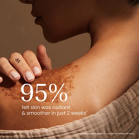 Image 1 - A persons bare shoulder with a brown body scrub applied, a hand with light pink nails and an M tattoo touching it, showing the text 95% felt skin was radiant & smoother in just 2 weeks* *According to participants in a study that lasted 56 days. Image 2 - A persons hands hold an open dark green jar of face mask, with a finger scooping out the golden-brown product, next to visible text that reads: Illuminates skin, Nourishes, Exfoliates, Soothes, izil, GOLDEN HONEY & SAFFRON, MOISTURISING FACE MASK, NOURISH, MOISTURISE & SOOTHE, MASQUE VISAGE HYDRATANT AU MIEL DORE & SAFRAN, and نوریش، مویستورایز و سوت. Image 3 - A product photo features two iziL skincare jars on a light stone platform: a dark jar on top labeled GOLDEN HONEY & SAFFRON MOISTURISING FACE MASK with additional text NOURISH MOISTURISE & SOOTHE with natural ingredients & oils and an arrow pointing to it saying Nourish; and a brown jar below labeled GOLDEN HONEY NOURISHING ALMOND SCRUB with additional text EXFOLIATE MOISTURISE & NOURISH Argan Oil, Sweet Almond, Wheat Germ Oil, Coconut Oil and Walnut Shell Powder and an arrow pointing to it saying Exfoliate; these products are surrounded by almonds in a test tube and loose, honeycomb dripping honey, and a small container of saffron threads.