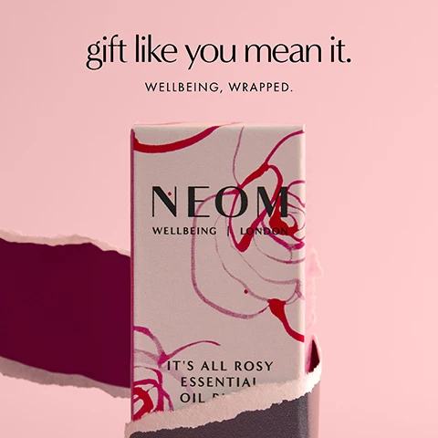 Image 1 - A NEOM product box wrapped in pink and red floral paper stands on a pink background with a torn dark red paper edge, featuring the text gift like you mean it. WELLBEING, WRAPPED. NEOM WELLBEING LONDON ITS ALL ROSY ESSENTIAL OIL BLEND. Image 2 - Two small amber bottles with black caps sit on a deep pink background, with the text Its All Rosy Limited Edition Expertly blended with rose, geranium and orange. Image 3 - An amber dropper bottle is tilted, with a drop of yellow liquid falling from it, against a golden-yellow background, with text that reads NEOM WELLBEING | LONDON ITS ESSEN and Powered by 100% natural fragrances Super soothing scent to help spark moments of calm. Image 4 - An amber glass essential oil bottle with a black ridged cap stands next to a portion of its white retail box, displaying the text A complex blend of 9 essential oils including rose, geranium and orange, on the bottle NEOM WELLBEING | LONDON IT’S ALL ROSY ESSENTIAL OIL BLEND Rose, Geranium & Orange, and on the box NEOM WELLBEING ITS ALL ROSY ESSENTIAL OIL BLEND Rose, Geranium & Orange 10 mL e 0.33 US fl.