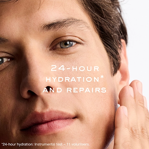 A close-up of a persons face with clear skin and a hand touching the cheek, set against a white background, with the white text 24-HOUR HYDRATION* AND REPAIRS, and at the bottom *24-hour hydration: Instrumental test – 11 volunteers.