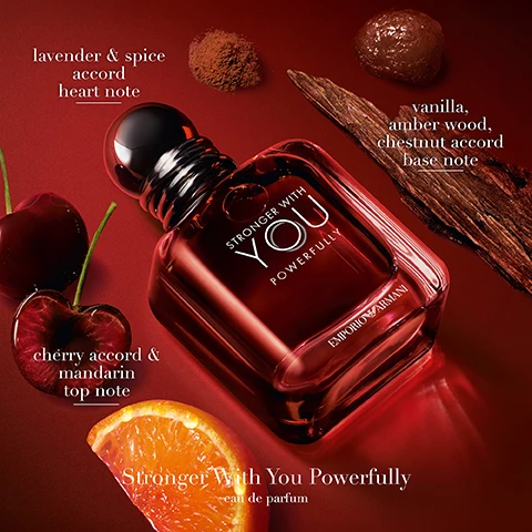 Image 1 - A deep red perfume bottle, Stronger With You Powerfully by Emporio Armani, is displayed on a red surface surrounded by ingredients such as cherries, an orange slice, brown spice powder, wood chips, and a dark sticky substance, with accompanying text labels reading lavender & spice accord heart note, vanilla, amber wood, chestnut accord base note, cherry accord & mandarin top note, and Stronger With You Powerfully eau de parfum. Image 2 - The image displays five Emporio Armani Stronger With You perfume bottles, arranged in a gradient from light amber to deep red on a reflective surface against an amber-lit background, with the prominent text STRONGER WITH YOU at the top, and labels on the bottles reading STRONGER WITH YOU, STRONGER WITH YOU INTENSELY, STRONGER WITH YOU POWERFULLY, STRONGER WITH YOU ABSOLUTELY, and STRONGER WITH YOU PARFUM, all by EMPORIO ARMANI; below the bottles is a comprehensive chart detailing EAU DE TOILETTE with FRESH AMBERY, SWEET & FRESH, MEDIUM PROJECTION, EVERYDAY, INTENSITY ••, LONGEVITY ••; INTENSELY with SWEET & SPICY AMBERY, ALL-DAY PERFORMANCE, VERSATILE PROJECTION, DAY-TO-NIGHT, INTENSITY •••, LONGEVITY •••; POWERFULLY with FOUGERE AMBERY, POWERFULLY LASTING, POWERFUL PROJECTION, DAY AND NIGHT, INTENSITY •••, LONGEVITY •••; ABSOLUTELY with WOODY AMBERY, LONG LASTING TRAIL, BOLD PROJECTION, DATE NIGHT, INTENSITY ••••, LONGEVITY ••••; and PARFUM with LEATHERY AMBERY, SUPREME TRAIL, UNFORGETTABLE PROJECTION, AFTER DARK, INTENSITY ••••, LONGEVITY ••••.