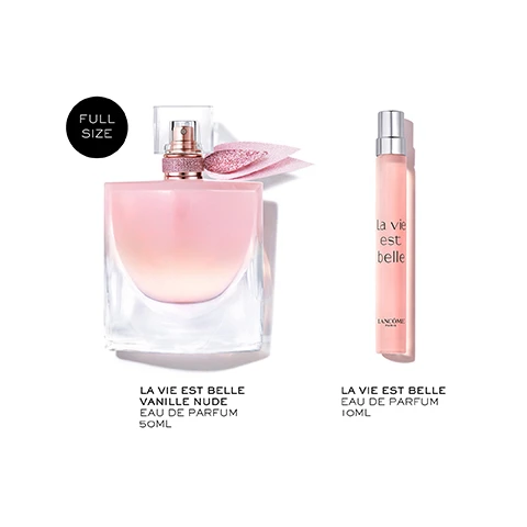 Image 1 - The image shows two perfume bottles, a larger rectangular glass bottle with pink liquid, a glittery rose gold neck, and a pink ribbon, and a smaller cylindrical pink travel spray bottle with a silver cap; visible text in the image includes FULL SIZE, la vie est belle, LANCÔME, PARIS, LA VIE EST BELLE VANILLE NUDE EAU DE PARFUM 50ML, and LA VIE EST BELLE EAU DE PARFUM 10ML. Image 2 - A person with dark skin holds a pink rectangular perfume bottle with a sparkly ribbon, their left hand visible with a diamond ring, against a soft pink and orange background, with the text A POWERFUL SKIN SCENT. Image 3 - A pink perfume bottle with a sparkling pink ribbon sits under a clear glass cloche with a jeweled top, and the text reads LASTS ALL DAY LONG WITH EXCEPTIONAL 5-HOUR INTENSITY* *SELF-ASSESSMENT TEST, 69 WOMEN. Image 4 - Julia Roberts smiles broadly wearing a white shirt against a soft pink and purple sky with a blurred cityscape below, with the text La vie est belle VANILLE NUDE. Image 5 - Three La Vie Est Belle perfume bottles, two with light pink liquid and one with dark pink liquid, are displayed with three decorative pink and gold patterned boxes in green grass with small white flowers under a blue sky, featuring the visible text LA VIE EST BELLE COLLECTION, LANCÔME PARIS x Barbara Cox, LA VIE EST BELLE, Smile, Happiness, LORIGINAL EAU DE PARFUM, La vie est belle, NEW VANILLE NUDE, LELIXIR EAU DE PARFUM, La vie, and La vie est belle.