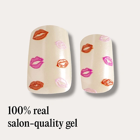 Image 1 - A close-up of two beige artificial fingernails, one wider than the other, both adorned with scattered small lip prints in shades of pink, purple, and reddish-brown, with the text 100% real salon-quality gel below them. Image 2 - A sheet of nude-colored nail polish strips patterned with red and pink kiss marks, with one strip partially peeled, is shown next to a bulleted list of features that reads: Easiest and gentlest mani in the world Last up to 14 days Fast & gentle 1-min removal Fully-cured - No LED Lamp required Comes in 10 sizes Long-lasting shine and chip-resistant Hema-free, vegan and cruelty-free Pre-cut and ready to go! Image 3 - A hand holds a sheet of light peach nail polish strips with red and pink kiss mark designs, and the same design is on the nails, with text reading No UV/LED lamp REQUIRED. Image 4 - A hand wearing a beige sweater sleeve holds a shiny red heart shape between the thumb and index finger, with nails painted in an iridescent polish featuring small pink lip and heart designs, alongside the text Long-lasting shine AND CHIP-RESISTANT. Image 5 - A hand with red-sleeved arm and nails decorated with small colorful kiss mark decals holds an Ace of Hearts playing card against a light background, with text that reads Lasts up to 14 days. Image 6 - A hand displays five almond-shaped nails with a nude base and small pink and red lip patterns, with the text 1 minute removal NO DAMAGE. Image 7 - A hand with clear nails decorated with red and pink kiss marks holds a pair of black-framed glasses, next to icons stating Cruelty-free, Vegan, HEMA-free. Image 8 - A set of nail accessories is shown, including 20 clear nail wraps with red and pink lip designs and varying sizes, a red Mylee 240 nail file 8.5cm long, and a wooden cuticle pusher 7.5cm long, with text that reads Includes: NAIL FILE & CUTICLE PUSHER. Image 9 - A Mylee Step by step guide shows four illustrated stages of nail wrap application and removal, with the accompanying text: Step by step 01 PREP Use a Mylee Wooden Cuticle Stick to gently push back your cuticles and buff the shine off your nail plates with a Mylee 240-grit nail file. Cleanse each nail using a Mylee Lint-Free Wipe* soaked in Mylee Prep & Wipe* to remove any oils - this helps the wraps adhere better and last longer. If you dont have these products, washing your hands is a good alternative. If your nails are naturally oily, apply Mylee Nail Dehydrator* as an extra step after cleansing. 02 STICK & WRAP Choose your favourite design and select the right width wrap for each nail - if youre between sizes, go slightly smaller. Peel the wrap from the sheet, touching only the end that wont go on the nail. Apply the wrap as close to the cuticle as possible without touching the skin. Press the wrap firmly from the centre outwards to avoid air bubbles. Use your thumb to press down and seal the edges. 03 TRIM & FILE Trim any excess as close to your nail length as possible using Mylee Curved Edged Scissors* to prevent the wrap being trapped and peeling off (the nail edges and the wraps must be aligned). Once you have cut off all the excesses, press the wrap down again to fully seal it in place. Lightly file underneath the free edge, if necessary, in one direction only, from top to bottom, using a Mylee 180-grit nail file. Avoid applying any oils or getting your hands wet for at least 2 hours after application to ensure maximum adhesion. Then youre set for up to 14 days! 04 REMOVE Quick, damage-free removal in just 1 minute. Apply Mylee Wrap Remover Oil* around the edges of the wrap. Gently lift one side with a Mylee Wooden Cuticle Stick and slowly slide it underneath, adding more oil as needed. Once removed, wipe your nails and wash your hands. *Product sold separately.
