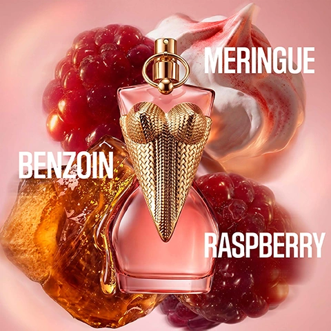Image 1 - A pink perfume bottle shaped like a female torso with a golden woven corset design is surrounded by a white meringue swirl with red streaks, a pile of red raspberries, and a translucent amber chunk of benzoin, with the visible text Meringue, Raspberry, Benzoin. Image 2 - The image displays four Jean Paul Gaultier Divine perfume bottles arranged horizontally, each featuring a golden bust-shaped top and a clear glass base containing liquid ranging from pink to amber, set against unique backgrounds depicting berries, flowers, and spices, with visible text that reads GAULTIER DIVINE, COUTURE EAU DE PARFUM Fruity AMBER, DIVINE EAU DE PARFUM Gourmand FLORAL, LE PARFUM EAU DE PARFUM INTENSE Amber FLORAL, ELIXIR PARFUM Floral AMBER, and a small scent intensity progress bar beneath each fragrance description.