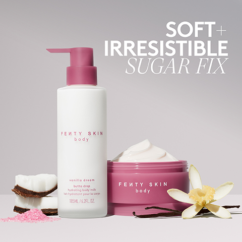 The image features a white pump bottle and a pink jar of Fenty Skin Body products, both labeled FENTY SKIN body, with the bottle additionally displaying vanilla dream butta drop hydrating body milk lait hydratant pour le corps 185ML / 6.2FL.OZ; coconut pieces, pink sugar, vanilla beans, and a vanilla flower are arranged around the products, and the words SOFT + IRRESISTIBLE SUGAR FIX are prominently displayed in the upper right.