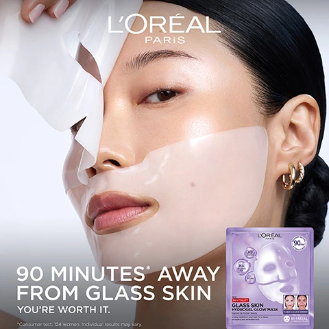 Image 2 - A womans face is shown as she applies a translucent LOréal sheet mask, with her eye visible and her hand lifting a corner of the mask, next to a purple LOréal Revitalift Glass Skin Hydrogel Glow Mask package, with the text LORÉAL PARIS 90 MINUTES* AWAY FROM GLASS SKIN YOURE WORTH IT. *Consumer test, 124 women. Individual results may vary. LORÉAL PARIS 90 MINUTES REVITALIFT GLASS SKIN HYDROGEL GLOW MASK Instant results! Visibly reduces fine lines, Hydrates and firms skin. With HA ADENOSINE VITAMIN C 1X FACIAL. Image 3 - A woman with glowing, clear skin holds a purple LOreal facial mask package, with large text displaying GLASS SKIN HYDROGEL MASK and VISIBLY PLUMP, GLOWING AND SMOOTH SKIN, and the package itself labeled LOREAL PARIS REVITALIFT GLASS SKIN HYDROGEL GLOW MASK, X1 FACIAL HYDROGEL MASK, RELEASES ACTIVES 90x PLUMPING CLEAR, TURNS CLEAR IN 30MINS. Image 4 - A womans face is split vertically into two sections, the left side shows her wearing a white sheet mask labeled BEFORE and the right side shows her bare face with radiant, smooth skin labeled AFTER, along with the text GLASS SKIN TRANSFORMATION IN ONLY 90 MINS*, *Consumer test, 124 women. Individual results may vary. Image 5 - Abstract image with glossy purple spheres representing active ingredients, featuring the text POWERED BY TOP DERM ACTIVES, [HYALURONIC ACID], [GLYCERIN], and [ADENOSINE]. Image 6 - Three women with diverse skin tones are shown applying or peeling off clear, shiny face masks, with the text Glass Skin For All Skin Types and Clinically Tested On All Skin Types visible. Image 7 - A person holds a LOréal Glass Skin Hydrogel Mask and a LOréal Glass Skin Liquid Cream against a purple background, with text that reads: COMPLETE YOUR GLASS SKIN ROUTINE, GLASS SKIN TRANSFORMATION IN ONLY 90 MINS, HYDROGEL MASK, UP TO 100 HOURS OF HYDRATION AND GLOW, LIQUID CREAM, POWERED BY HYALURONIC ACID CLINICALLY TESTED ON ALL SKIN TYPES, LOréal Paris, Glass Skin Hydrogel Glow Mask, 90%, NEW FORMULA, GLASS SKIN, *Consumer test: 124 women. Individual results may vary. **Instrumental test, 26 women. Clinical test, 70 women. Image 8 - A pair of hands pulls a purple LOréal Paris sheet mask packet from a white and purple box of LOréal Paris Revitalift Glass Skin Hydrogel Glow Masks, against a purple background, with visible text AVAILABLE IN 4-PACK FORMAT, LORÉAL PARIS, 4X MASKS, NEW REVITALIFT GLASS SKIN HYDROGEL GLOW MASK, Inspired by Korean Beauty, Visibly transform your skin for a dewy, plumped and refreshed look, X4 FACIAL HYDROGEL MASK, RELEASED ACTIVE 90% TURNS CLEAR, and TURNS CLEAR IN MOMENTS.