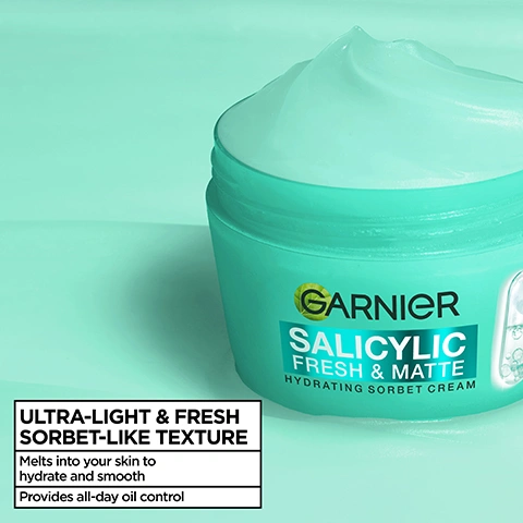 Image 1 - A turquoise jar of Garnier Salicylic Fresh & Matte Hydrating Sorbet Cream with a visible wavy cream texture on top is shown against a turquoise background, with additional text reading ULTRA-LIGHT & FRESH SORBET-LIKE TEXTURE, Melts into your skin to hydrate and smooth, Provides all-day oil control. Image 2 - A light green jar of cream with a swirl on top is centered against a bright teal background, framed by translucent tubes filled with bubbles, with the visible text Garnier Salicylic Fresh & Matte Hydrating Sorbet Cream. Image 3 - A close-up of a mans face shows a finger applying a green cream to his cheek, with text overlay that reads: CLINICALLY PROVEN TO SOOTHE BLEMISHES, Delivers up to 24 hours hydration*, Reduces appearance of blemishes**, *Instrumental test 24 subjects, **Clinical study, 4 weeks, 41 volunteers. Image 4 - Close-up of a smiling young woman with healthy, glowing skin against a teal background, with text in a white box that reads: SUITABLE FOR SENSITIVE SKIN, For all skin types & tones, Dermatologically tested. Image 5 - A smiling woman applies green gel to her cheek with her finger. Text reads: HOW TO USE Gently spread onto face & neck using circular motions. Image 6 - Three stacked Garnier hydrating sorbet creams, green Salicylic Fresh & Matte, yellow Vitamin C Fresh & Bright, and blue Hyaluron Fresh & Plump, are shown against a light blue background, with the text Moisturising Revolution Ultra-light, fresh sorbet-like texture. Image 7 - A teal Garnier Salicylic Fresh & Matte Hydrating Sorbet Cream jar with a pill graphic on its side is displayed against a light blue background, accompanied by badges stating Cruelty Free International and Vegan Formula No animal derived ingredients or by products.