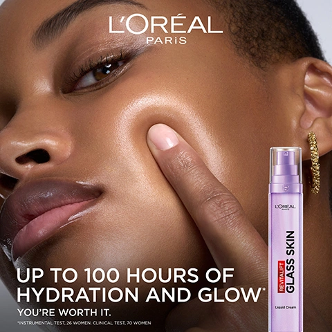 Image 1 - A person with glowing skin gently touches their cheek, with a purple LOréal Revitalift Glass Skin liquid cream bottle in the background, and the visible text states LORÉAL PARIS, UP TO 100 HOURS OF HYDRATION AND GLOW, YOURE WORTH IT., REVITALIFT GLASS SKIN, Liquid Cream, *INSTRUMENTAL TEST. 26 WOMEN. CLINICAL TEST. 70 WOMEN. Image 2 - A purple LOreal Paris Revitalift Glass Skin pump bottle is shown against a wavy purple and silver background, with text that reads OUR NEW GENERATION OF SKINCARE, HYDRATES UP TO 10 SKIN LAYERS DEEP, and GLOWY, DEWY, SMOOTH SKIN, plus a small R logo. Image 3 - An iridescent purple bubble graphic on a light purple background with text that reads POWERED BY DERM ACTIVES, [HYALURONIC ACIDS], [VITAMIN CG + B3], [VITAMIN B5], and a small registered trademark symbol. Image 4 - A cosmetic product demonstration image showing four panels of under-eye areas, with Before and Immediately After results for both a darker and lighter skin tone, and the visible text: INSTANT GLASS SKIN ON BARE SKIN BEFORE IMMEDIATELY AFTER SMOOTH LINES, REPLUMP, GLOW VISUALISATION OF THE EFFECT OF PRODUCT ROUTINE: *GLASS SKIN LIQUID CREAM ON THE SKIN **GLASS SKIN LIQUID CREAM + REVITALIFT FILLER HYALURONIC ACID SERUM. INDIVIDUAL RESULTS (AFTER 1 APPLICATION). INDIVIDUAL RESULTS WILL VARY. Image 5 - A purple LOreal Revitalift Glass Skin Liquid Cream bottle with a pump dispenser stands prominently, with a second bottle partially visible, against a swirling white and purple creamy background, displaying the text: OUR NEW INNOVATIVE LIQUID CREAM FORMULA REVITALIFT GLASS SKIN LOREAL PARIS Liquid Cream LIGHT AS A SERUM HYDRATING AS A CREAM NO STICKY FINISH. Image 6 - The image shows two purple LOreal Revitalift skincare products, a serum bottle and a liquid cream pump dispenser, against a purple background, with visible text that reads: OUR ULTIMATE GLASS SKIN ROUTINE, 1 SERUM, LOREAL REVITALIFT HYALURONIC ACID + PEPTIDE Anti-Wrinkle Serum, HYDRATES, REPLUMPS & SMOOTH, 2 LIQUID CREAM, LOREAL PARIS REVITALIFT GLASS SKIN Liquid Cream, HYDRATES & GLOWS. INSTANT GLASS SKIN FINISH, and a circled R logo. Image 7 - Two women with healthy, glowing skin, one with a darker skin tone and short hair wearing a gold hoop earring, and the other with a lighter skin tone and dark hair, with text that reads: CLINICALLY TESTED ON ALL SKIN TYPES, VISIBLY, HYDRATE, REPLUMP, SMOOTH LINES, GLOW, *CLINICAL SCORAGE 4 WEEKS 53 WOMEN.