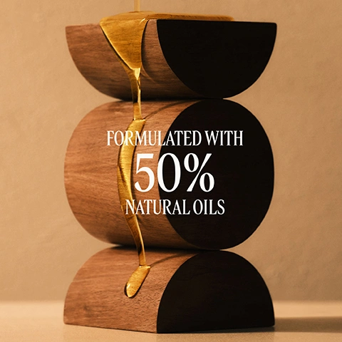 Image 1 - A golden liquid pours over three stacked, semi-circular wooden blocks, with the text Formulated with 50% Natural Oils. Image 2 - A persons bare back and shoulder with a hand resting on the shoulder, showing moisturized skin, with text that reads +25% MOISTURISED SKIN* and *Efficacy tests with 33 women after 4 weeks.