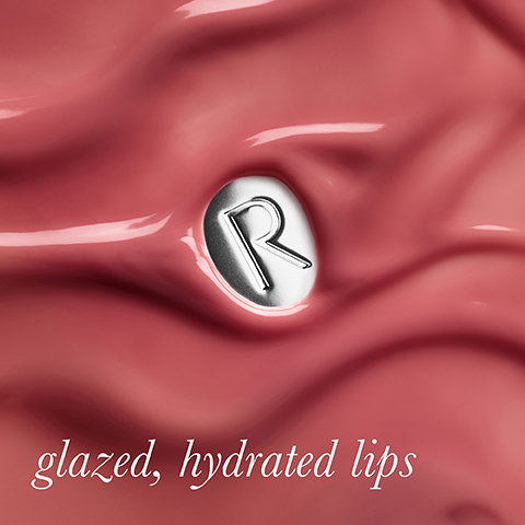 A close-up of a glossy, wavy pink substance with a silver oval emblem featuring a stylized R, and white text that reads glazed, hydrated lips.