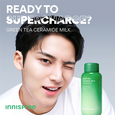 Image 1 - A young man with dark hair winks and smiles while standing next to a green bottle of skincare product, with text reading READY TO SUPERCHARGE? GREEN TEA CERAMIDE MILK, and on the bottle GREEN TEA CERAMIDE MILK BARRIER ESSENCE Super Green Tea Hyaluronic Acid Ceramide, HYDRATE + PLUMP, 160 mL 5.41 fl. oz., and the brand logo Innisfree. Image 2 - A green Innisfree Green Tea Ceramide Milk bottle, with product spilling over its sides and green tea powder at its base, is shown with the visible text Get the Korean Glow, 01 Lightweight Milk Formula, 02 3-second Hydration Boost, 03 Instant Plumping & Glow, and on the bottle itself Green Tea Ceramide Milk, Barrier + Hydrate, Innisfree, 160ml 5.41FL.OZ., and vertically Hydrate + Plump. Image 3 - A green bottle labeled Green Tea Ceramide Milk Barrier Essence is partially submerged in a glass of milky white liquid with green leaves, displaying text Damaged moisture barrier repaired immediately after usage 119%* Instant boost of hydration in 3 seconds +1168%*, along with bottle text Super Green Tea™ 9 Hyaluronic Acid Ceramide, a vertical label HYDRATE + PLUMP, and a footnote *Based on a 14 days clinical study on 31 women ages 20 to 35 who feel that their skin is sensitive and are concerned about dryness and redness. Image 4 - A close-up of a green leaf with water droplets on the left and a lighter green background on the right, displays text about powerful hydrating ingredients: POWERFUL HYDRATING INGREDIENTS Super Green Tea™ Innisfree exclusive green tea for intensive hydration Green Tea Ceramide Plant-based ceramide for strengthened barrier repair 9 Hyaluronic Acids Intensive hydration for dewy skin Peptide & Niacinamide For bright and firm looking skin. Image 5 - A close-up of a green tea leaf covered in water droplets against a light grey background, with text that reads What Is Super Green Tea™? Green Tea Extract & Seed Oil Encapsulated into Micro Sized Liposomes. Image 6 - Light green fluid-like splashes are visible on a textured green background with text that reads Feather-Like Fast Absorbing Lightweight Milk Texture. Image 7 - A green bottle labeled GREEN TEA CERAMIDE MILK BARRIER ESSENCE with Green Tea Ceramide Hyaluronic Acid and HYDRATE + PLUMP is partially submerged with a large green leaf in a glass of green liquid, accompanied by the text All-in-one Korean Milky Toner, Prep like a toner, Boost hydration like a serum, and Shield hydration like a moisturiser. Image 8 - A young man in a pink sweater holds a green skincare bottle and touches his lips, with text reading FOR ALL SKIN TYPES, Vegan, Non-Comedogenic, Dermatologically Tested, and on the bottle GREEN TEA CERAMIDE MILK BARRIER ESSENCE, Super Green Tea, 5-Hyaluronic Acid, Ceramide, HYDRATE + PLUMP, INNISFREE, 160 mL / 5.40 fl. oz.