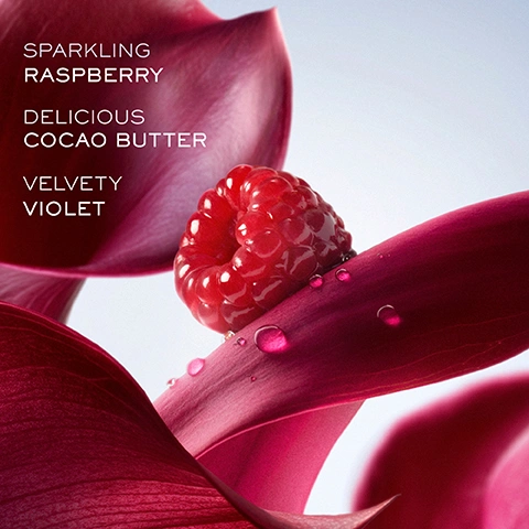 Image 1 - A close-up shows a vibrant red raspberry with water droplets on a deep magenta petal, surrounded by more magenta petals against a light blue background, with text that reads SPARKLING RASPBERRY, DELICIOUS COCAO BUTTER, VELVETY VIOLET. Image 2 - A pink Lancome Paris La vie est belle LELIXIR Hair & Body Mist bottle stands next to a dark pink glass Eau de Parfum bottle with a sparkly black wing-like embellishment, with text at the top of the image reading Wear Alone or Layer With Your Eau de Parfum. Image 3 - A pink hair and body mist bottle and a dark red perfume bottle with a sparkly black bow are shown against deep pink petals and floating raspberries, with the visible text Lancome Paris La vie est belle LELIXIR HAIR & BODY MIST DELICIOUSLY PORTABLE FOR EASY REFRESHMENT ON THE GO. Image 4 - Three Lancôme La vie est belle hair and body mists in pink, peach, and light pink, with water droplets, are displayed against a light blue sky with white iris petals, a fuchsia petal, two red raspberries, and two vanilla pods, with text reading LANCOME PARIS La vie est belle LELIXIR HAIR & BODY MIST, LANCOME PARIS La vie est belle LORIGINAL HAIR & BODY MIST, LANCOME PARIS La vie est belle VANILLE NUDE HAIR & BODY MIST, and MIX AND MATCH TO CREATE YOUR PERSONALISED SCENT. Image 5 - Three Lancôme La vie est belle Hair & Body Mists are featured: LOriginal in a peach bottle with white flowers and caramel, Vanille Nude in a light pink bottle with a vanilla bean and white petals, and LElixir in a vibrant pink bottle with red petals and raspberries, accompanied by the text Discover New Delicious Ways To Smile Our Three New Gourmand Expressions LOriginal Vanille Nude LElixir, and ingredient lists including Iris Caramel Patchouli, Jasmine Vanilla Musk, and Raspberry Cocoa Butter Violet.